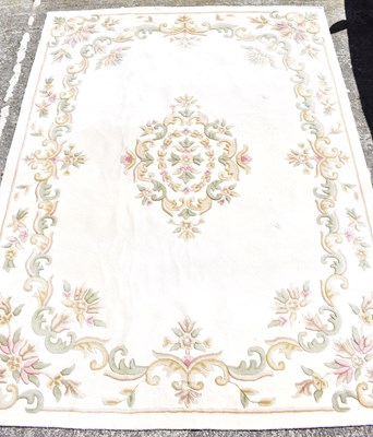 Lot 114 - A Chinese wool carpet with cream ground and...