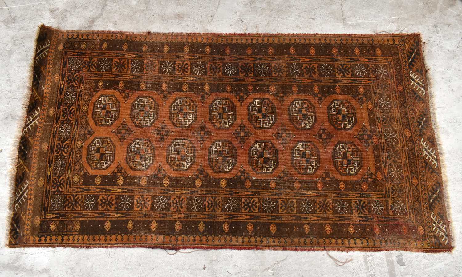 Lot 1433 - A Bokara type rug with elephant foot...