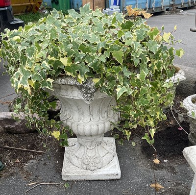 Lot 282 - A modern reconstituted stone pedestal urn on...