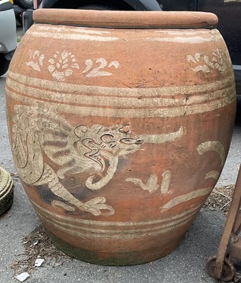 Lot 1264 - A large terracotta olive jar with linear...