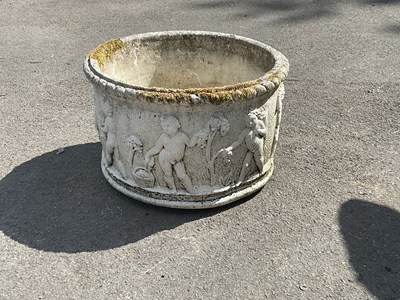 Lot 276 - A modern reconstituted stone circular planter...