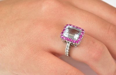 Lot 514 - An 18ct white gold diamond, pink sapphire and...