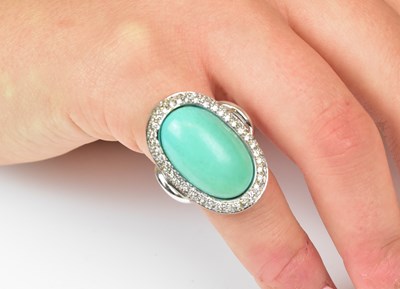 Lot 1171 - An 18ct white gold turquoise and diamond ring,...