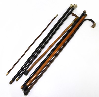 Lot 107 - A collection of six walking canes to include a...