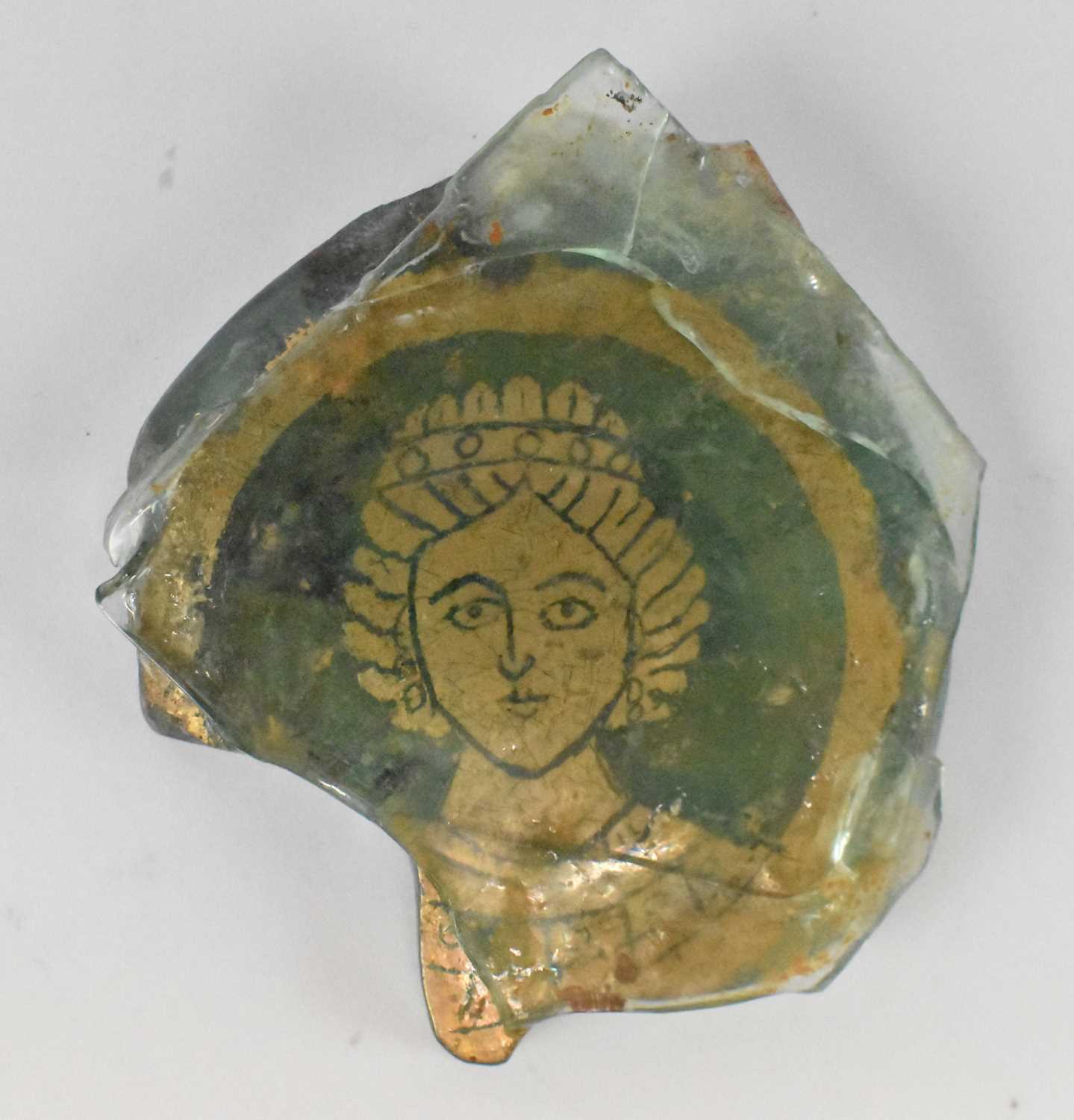 Lot 239 - An Ancient Greek style sandwich glass segment...