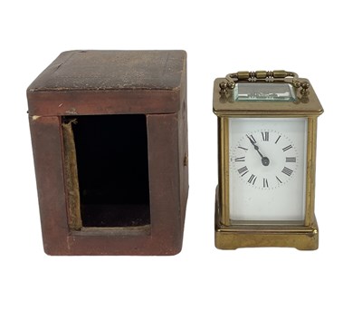 Lot 89 - A brass cased carriage clock, the white enamel...