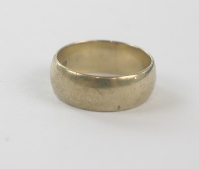 Lot 151 - A 9ct yellow gold broad wedding band, size Q,...