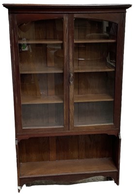 Lot 68 - An early 20th century oak bookcase, with pair...