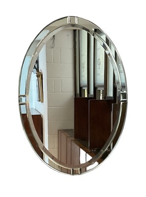 Lot 73 - A modern oval wall mirror, with mirrored frame,...