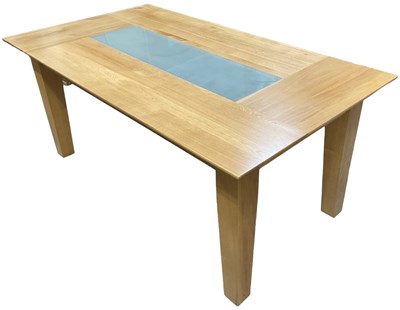 Lot 33 - A modern light oak kitchen table, with frosted...