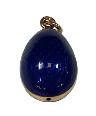 Lot 722 - FABERGÉ; a yellow metal blue enamelled egg...