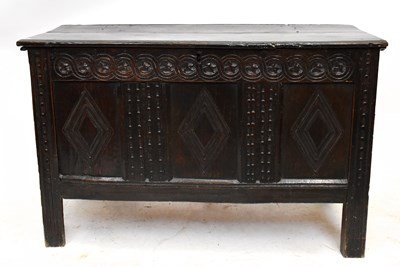 Lot 1508 - An 18th century carved and panelled oak coffer...