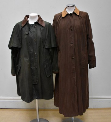 Lot 895 - MULBERRY; a full length green waxed coat with...