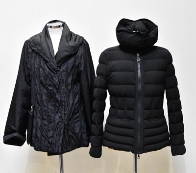 Lot 904 - MONCLER; a short black quilted down jacket...