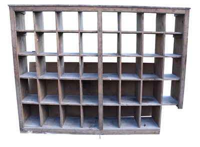 Lot 1165 - An old pine pigeon hole/shelf, width 235cm.