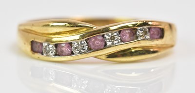 Lot 1179 - A 9ct yellow gold half eternity ring with...