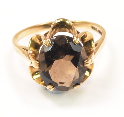 Lot 1186 - A 9ct yellow gold smoky quartz ring, size O...