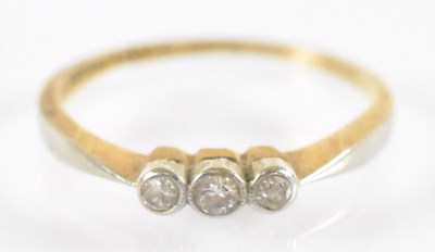 Lot 784 - An 18ct yellow gold and platinum three stone...