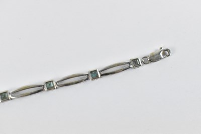 Lot 773 - A 9ct white gold aquamarine bracelet, set with...