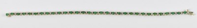 Lot 728 - A 9ct yellow gold emerald and diamond set...