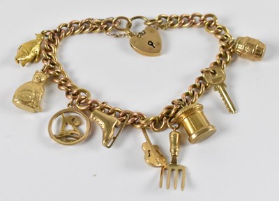 Lot 716 - A 9ct yellow gold charm bracelet, with padlock...