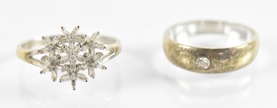 Lot 820 - A 9ct yellow gold flower ring set with small...