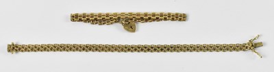 Lot 766 - A 9ct yellow gold gate link bracelet, with...