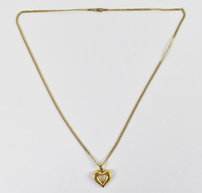 Lot 783 - A 9ct yellow gold necklace, suspending a 9ct...