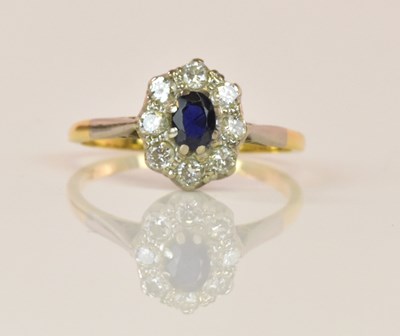 Lot 1267 - An 18ct yellow gold sapphire and diamond oval...