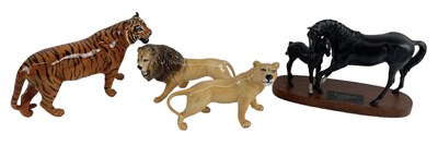 Lot 454 - BESWICK; a porcelain model of a female lion, a...