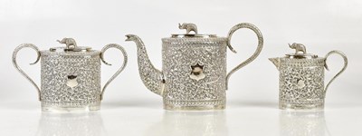 Lot 630 - An Indian white metal three piece tea service,...