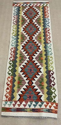 Lot 739 - A handmade wool Chobi Kilim runner, 197 x 67cm