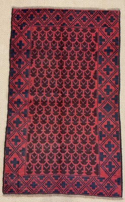 Lot 737 - A handmade wool Baluchi rug, 146 x 90cm