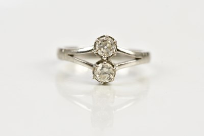 Lot 84 - A white metal diamond set two stone dress ring,...