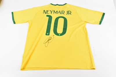 Lot 333 - NEYMAR JR; a Nike Brazil shirt, signed to the...