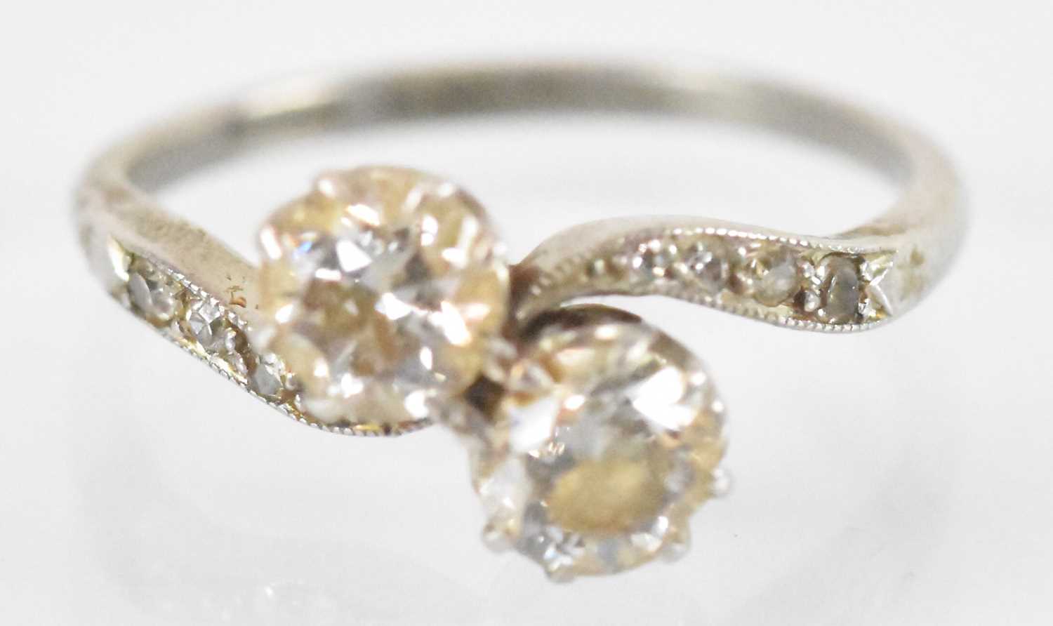Lot 733 - A platinum diamond crossover ring set with