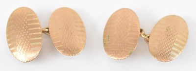 Lot 811 - A pair of 9ct yellow gold oval cufflinks,...