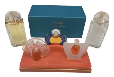 Lot 497 - LALIQUE; a cased set of three perfume bottles...