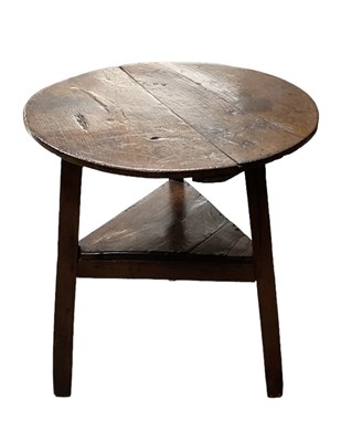 Lot 26 - A 19th century oak cricket table, diameter 70cm.