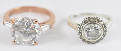 Lot 817 - A 9ct rose gold ring set with large white...