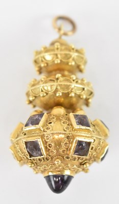 Lot 719 - A yellow metal amethyst set three tier pendant,...