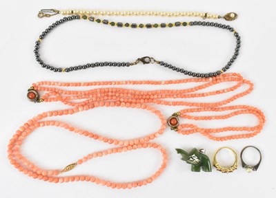 Lot 816 - A coral bead necklace with 14ct yellow gold...