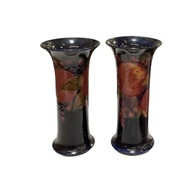 Lot 429 - WILLIAM MOORCROFT; a pair of blue ground...