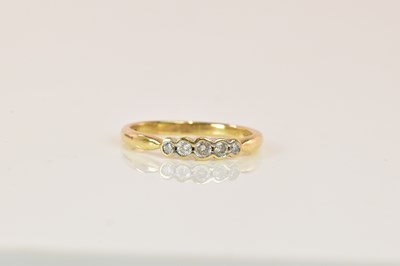 Lot 1277 - A 9ct yellow gold graduated five stone collet...