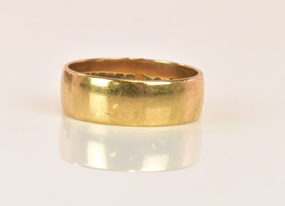 Lot 1279 - A broad 9ct yellow gold wedding band, size J,...