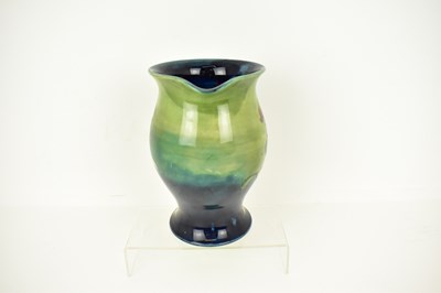 Lot 517 - WALTER MOORCROFT; a large pottery jug...