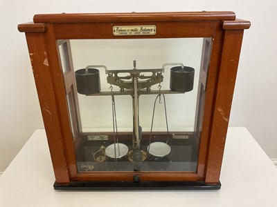 Lot 69 - A mahogany and glazed cased brass...