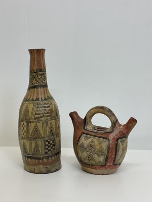 Lot 79 - A North African handled vessel with twin...