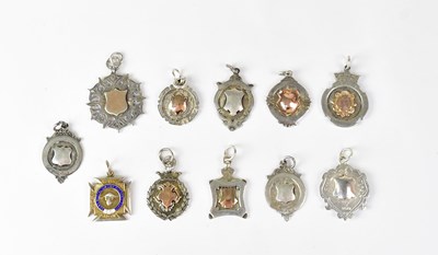 Lot 1305 - Eleven hallmarked silver various prize fobs,...