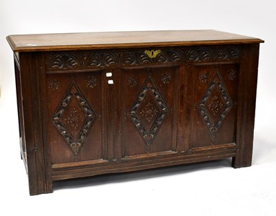 Lot 73 - A late 19th century oak three-panel coffer...